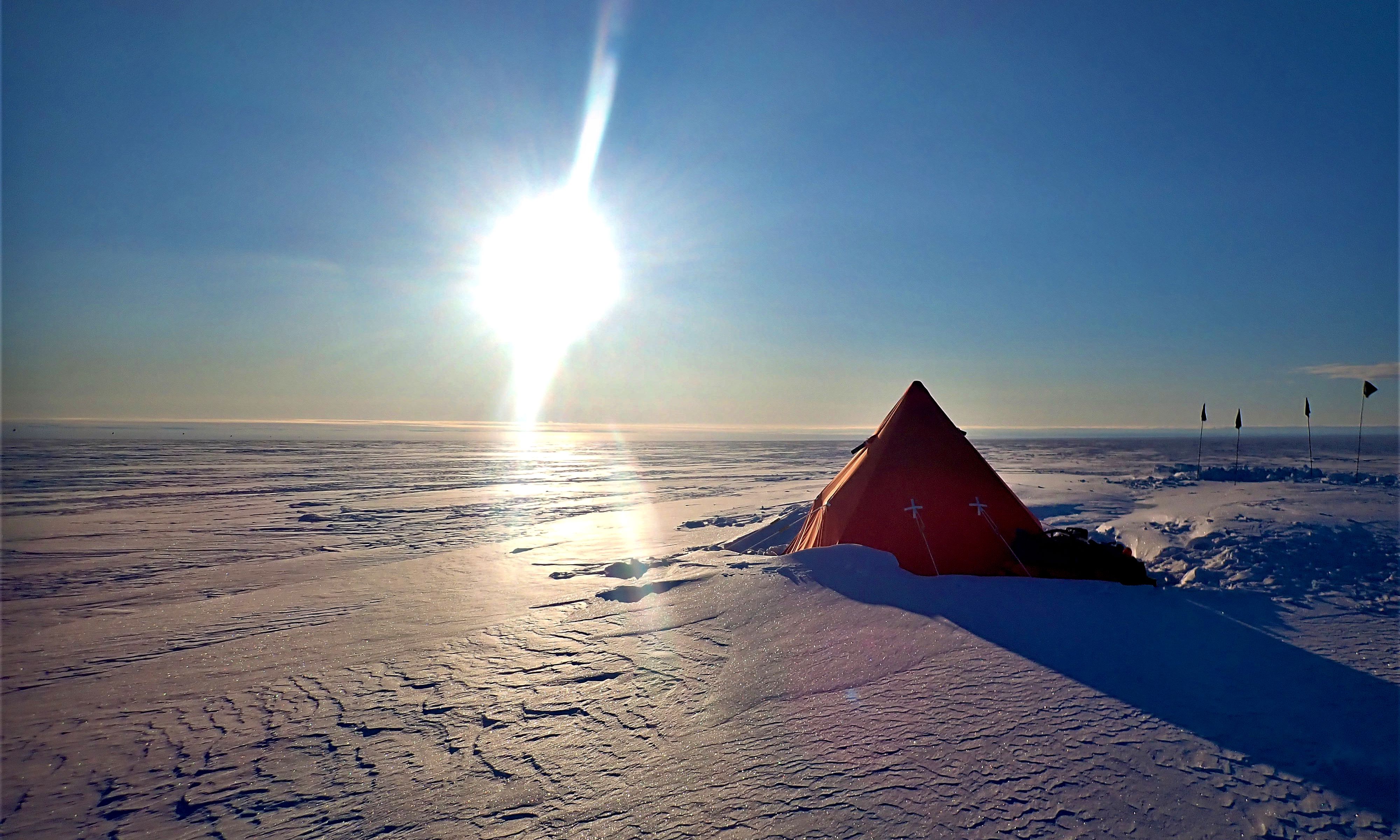 Photo of a pyramid tent in the snow on Sherman Island